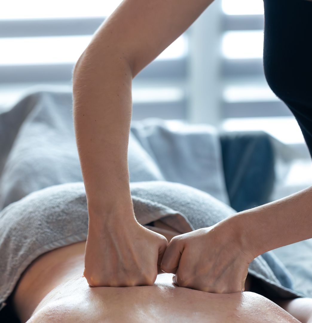 Deep tissue massage being applied to a client's back