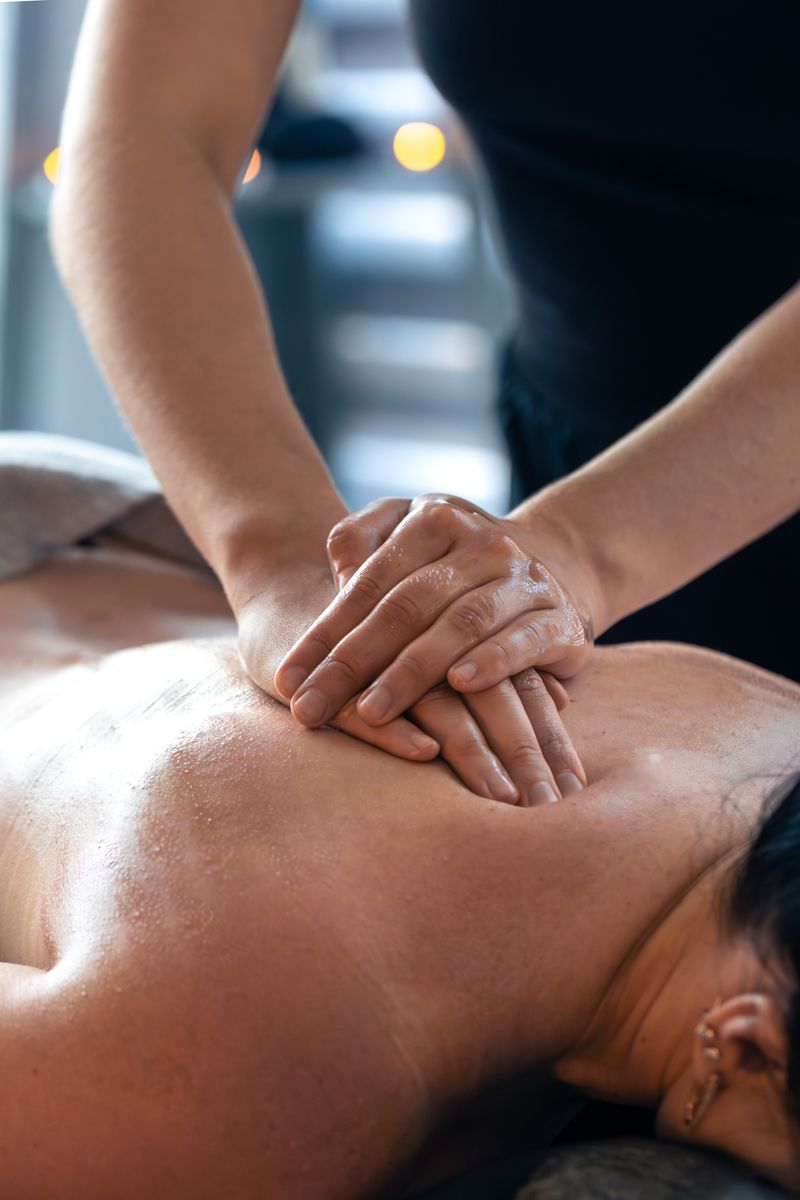 Hands applying pressure during back massage