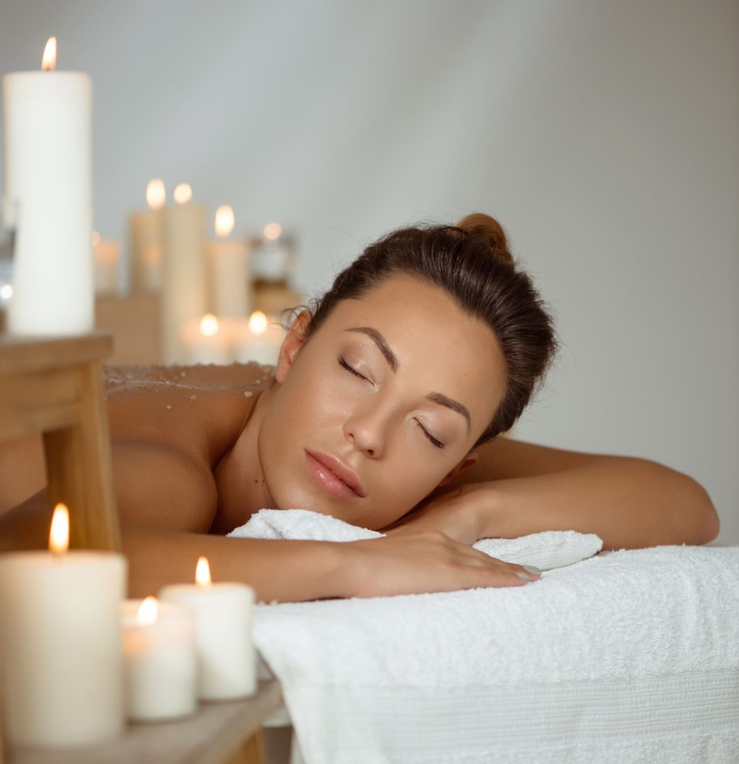 Client relaxing during a candlelit massage