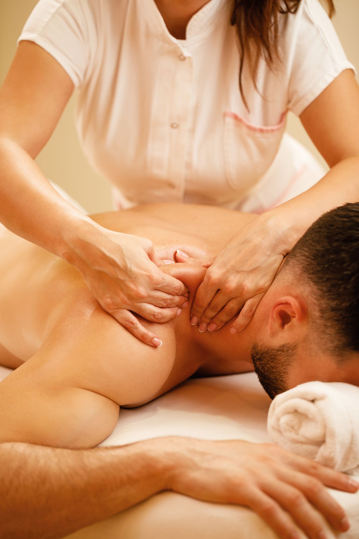 Massage therapist massaging a client